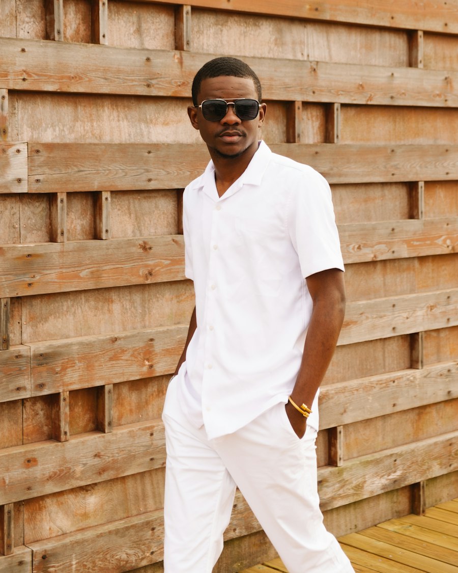 Man in a white polo shirt and sunglasses